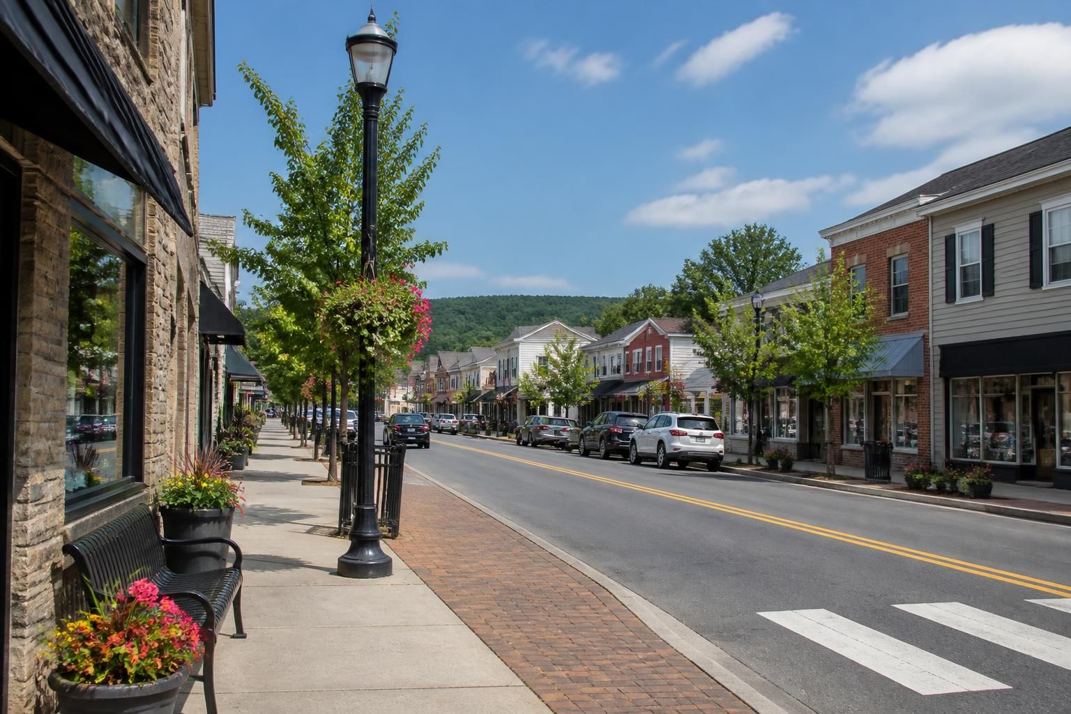 Clean Brodheadsville main street with local buildings.